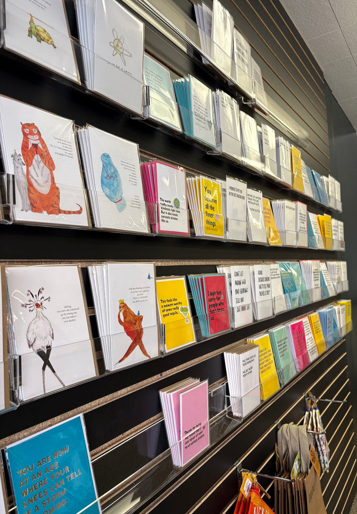 The wall of greeting cards at Yarnology.