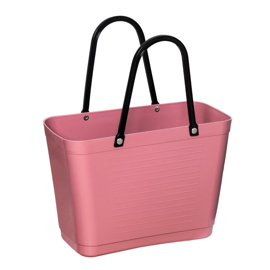 Pink tote bag with black handles.