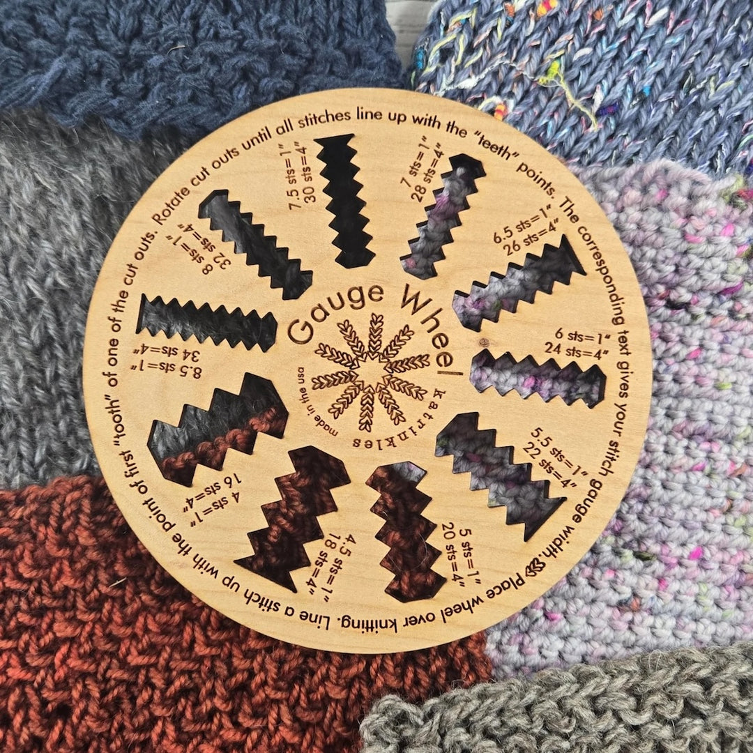 A wooden wheel with cut out places indicating different gauge counts. There are places you can see the fabric lining up with the counts and places it doesn't. If you can read stitches, you can use this tool. 