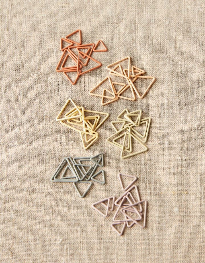 All of the stitch markers included with this product sorted by color.