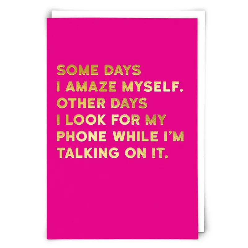 Pink card with foil text that reads, "Some Days I Amaze Myself. Other Days I Look for my phone while I'm talking on it."