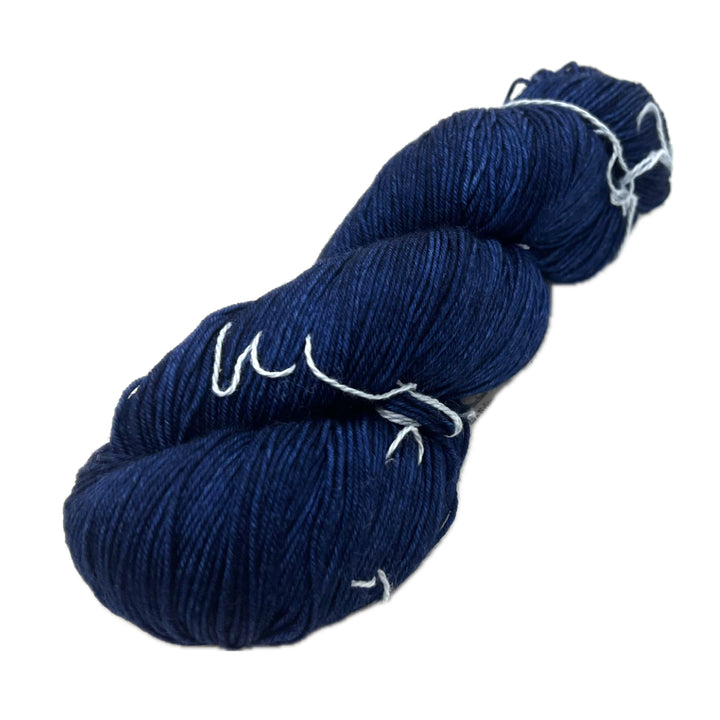 Deep blue skein of yarn.