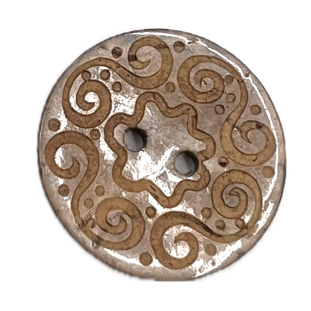 2 holed button with spirals carved into it.