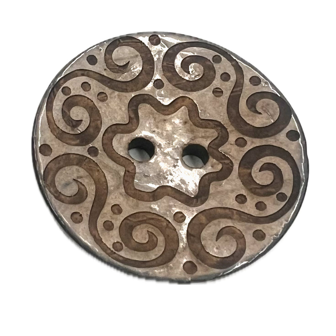 Large 2 holed button with spirals carved into it. 
