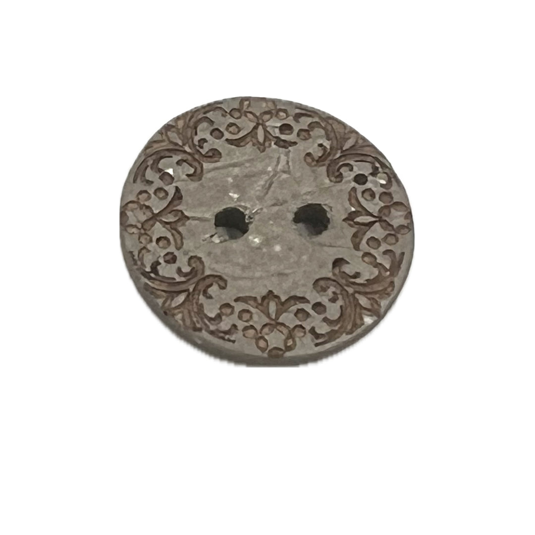 Ornate 2 hole button made out of coconut.