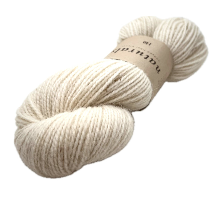 The lightest of the natural skeins. It's called Cria and it's the color of cream you always hope for.