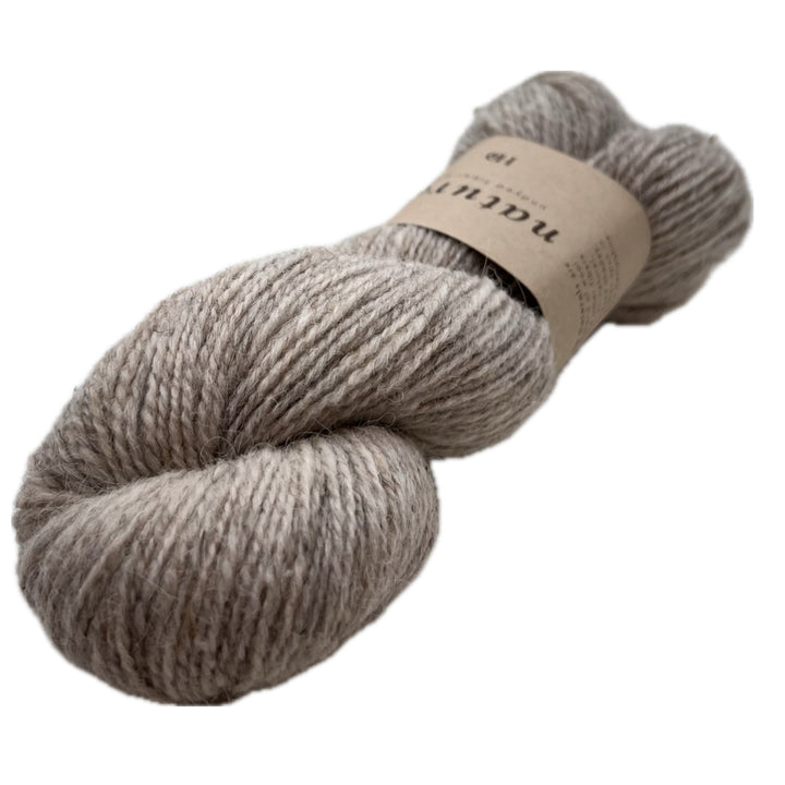 This is the middle of these 3 skeins color wise. Beige doesn't even begin to describe the richness of Dam. It's got the depth of color only accomplished by natural fiber.