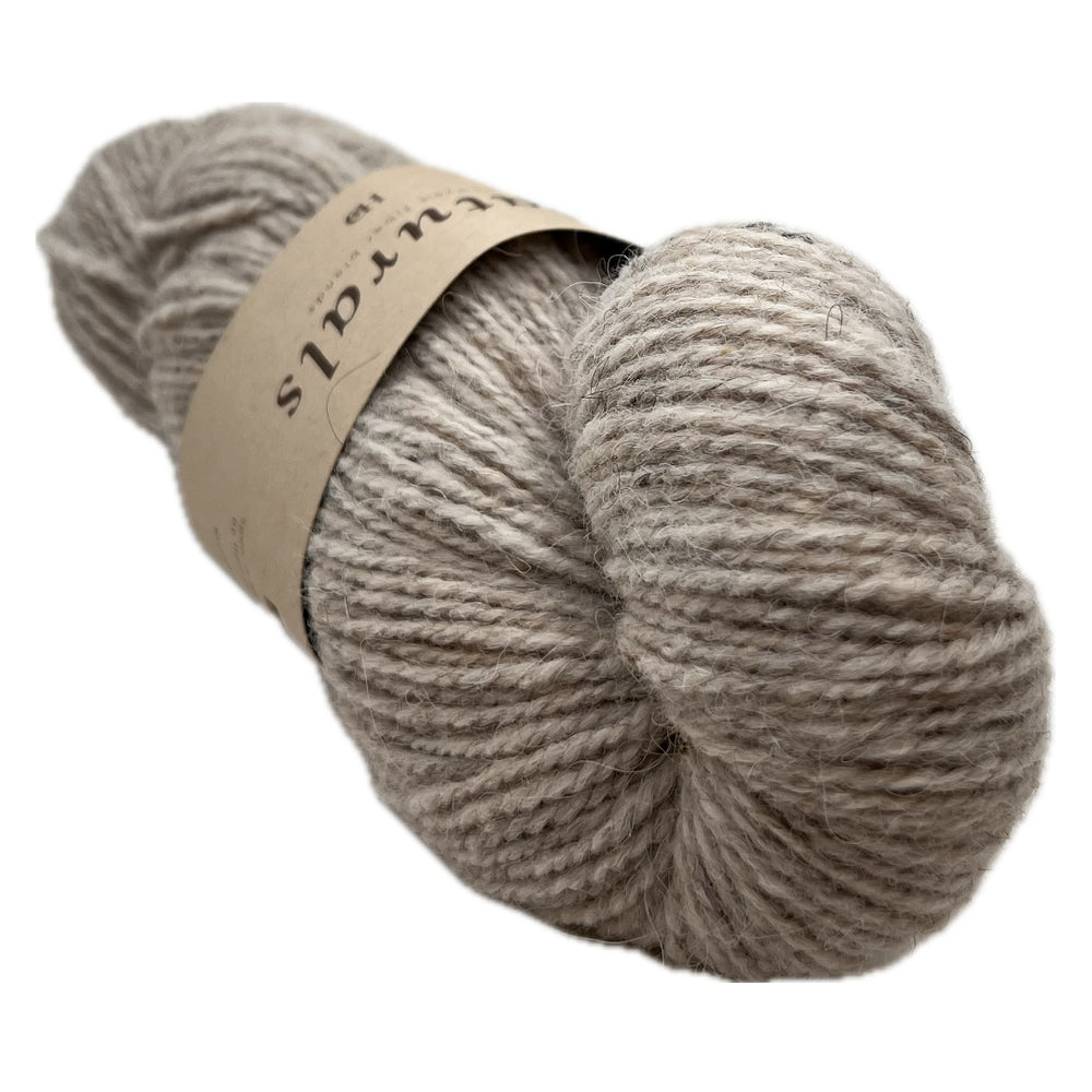 This is the middle of these 3 skeins color wise. Beige doesn't even begin to describe the richness of Dam. It's got the depth of color only accomplished by natural fiber.