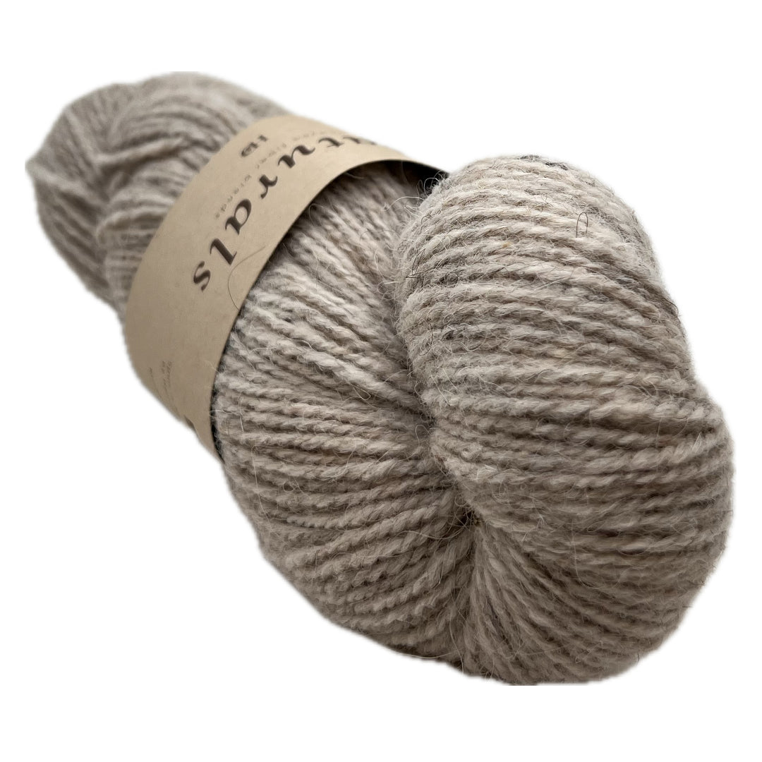 This is the middle of these 3 skeins color wise. Beige doesn't even begin to describe the richness of Dam. It's got the depth of color only accomplished by natural fiber.