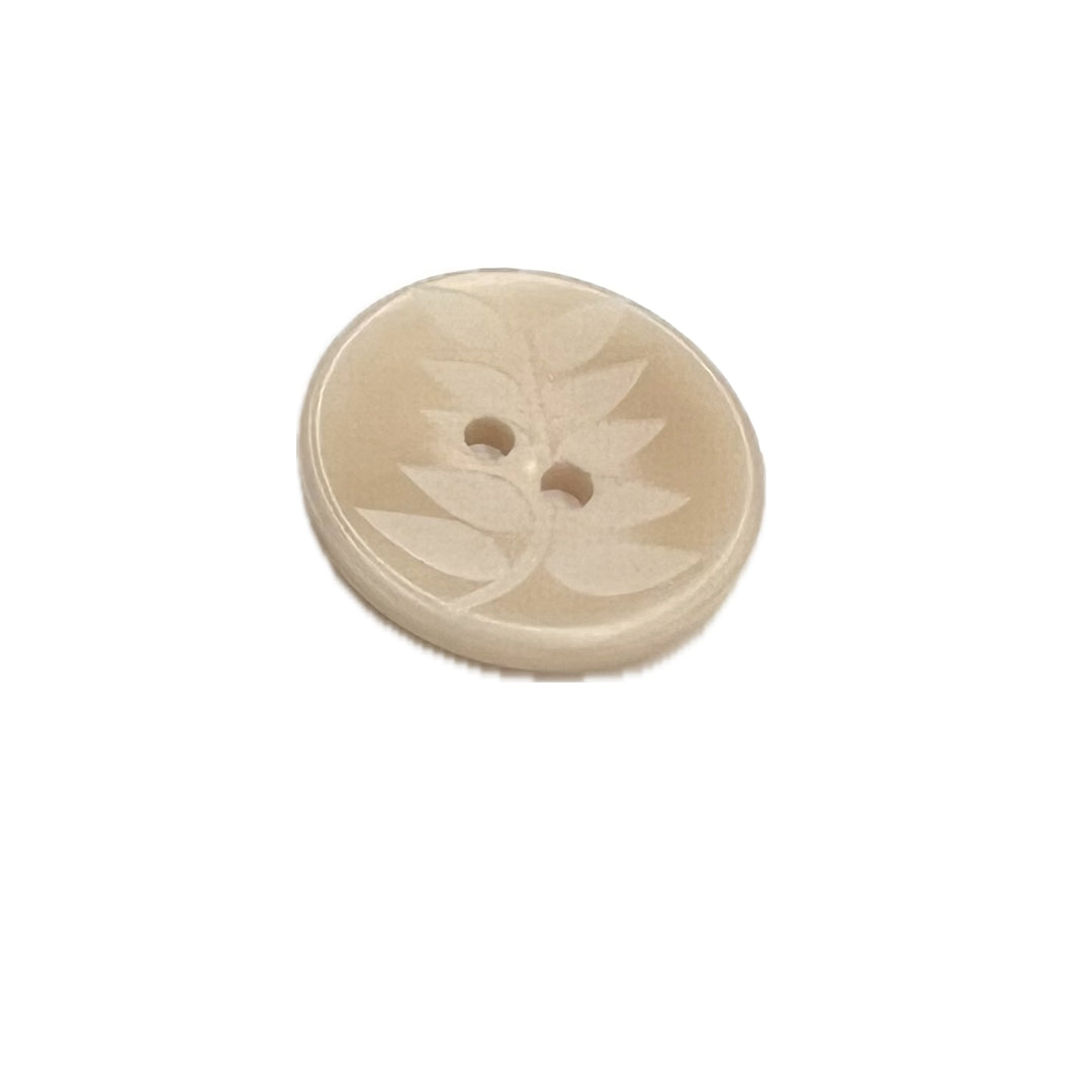 Round plastic button with a fern pattern and 2 hole. 