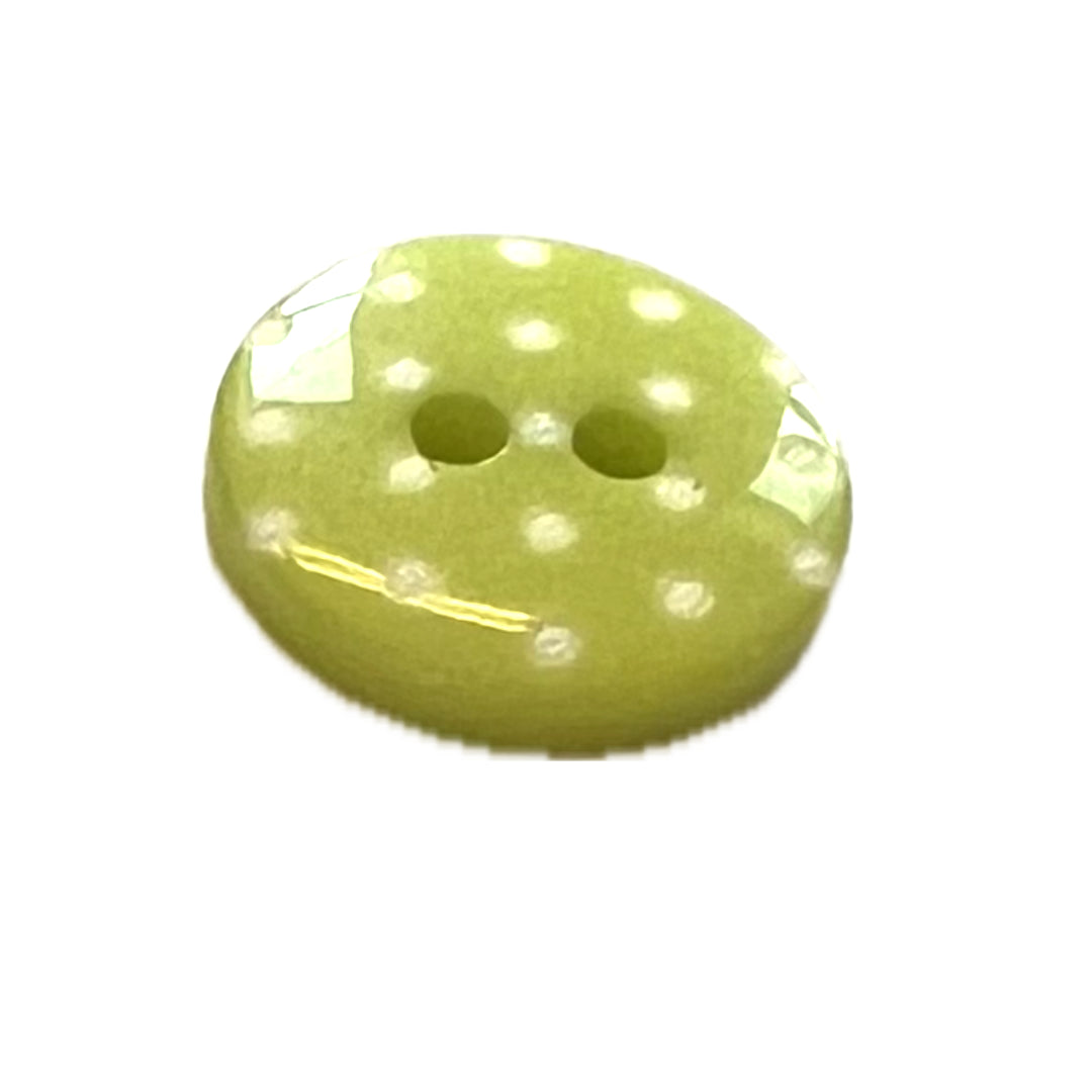 green button with white polkadots