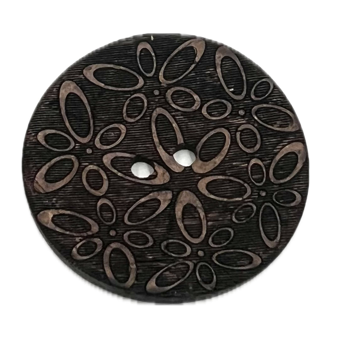 2 holed buttons with ovals carved into it, looking vaguely like flowers.