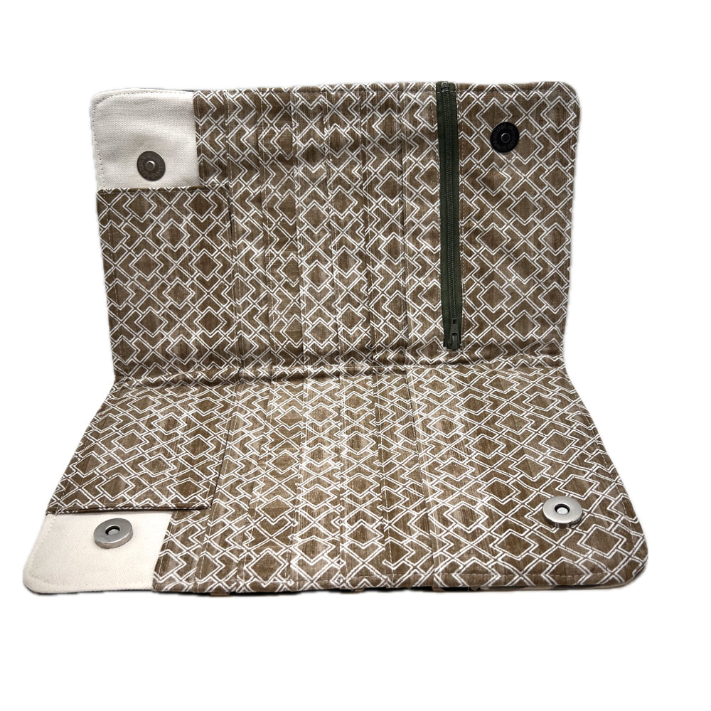 The inside of a needle organizer featuring a brown and beige geometric pattern.