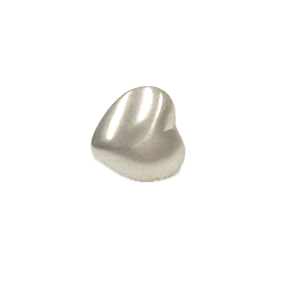 Plastic shank button shaped like a heart.