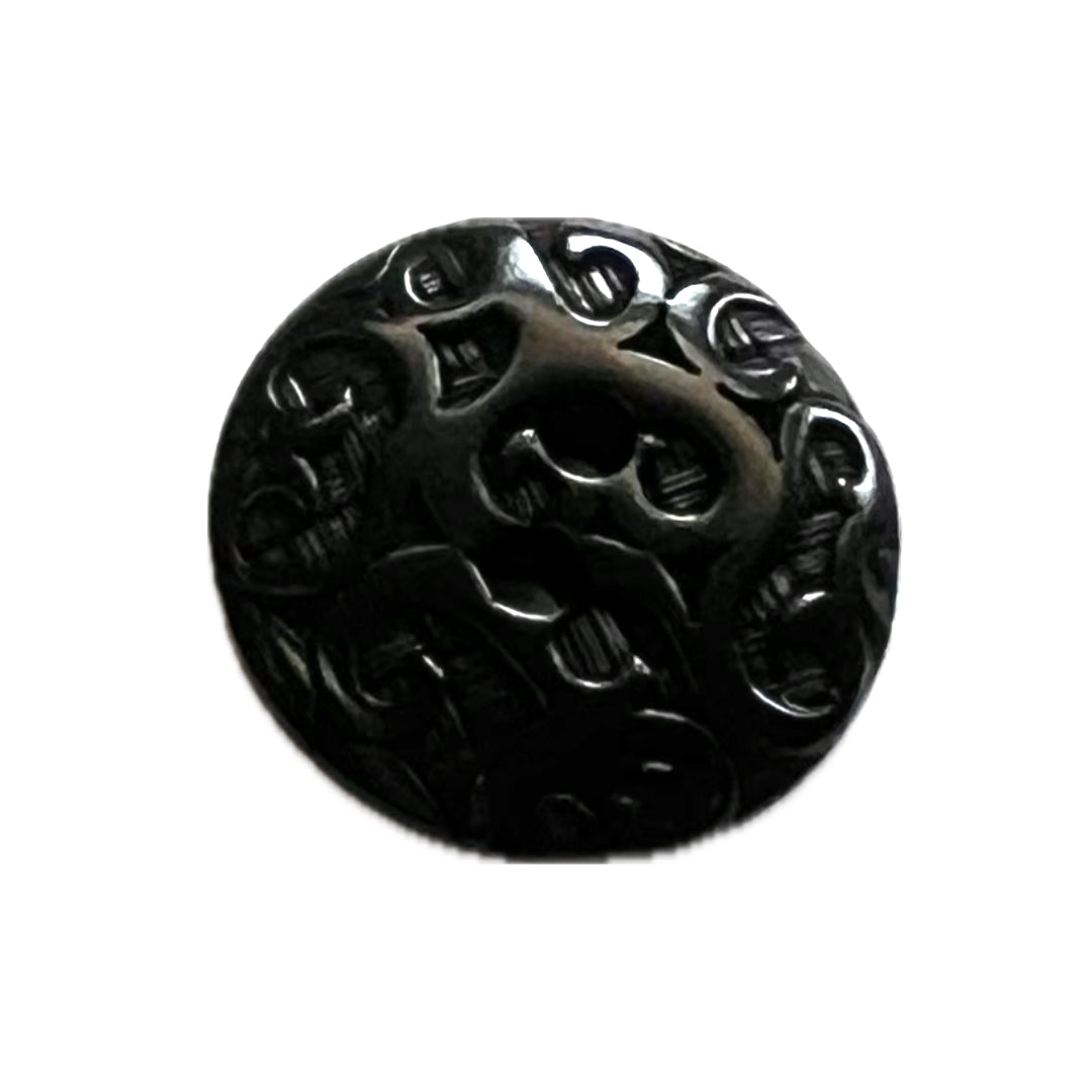 ornate button with 2 holes.
