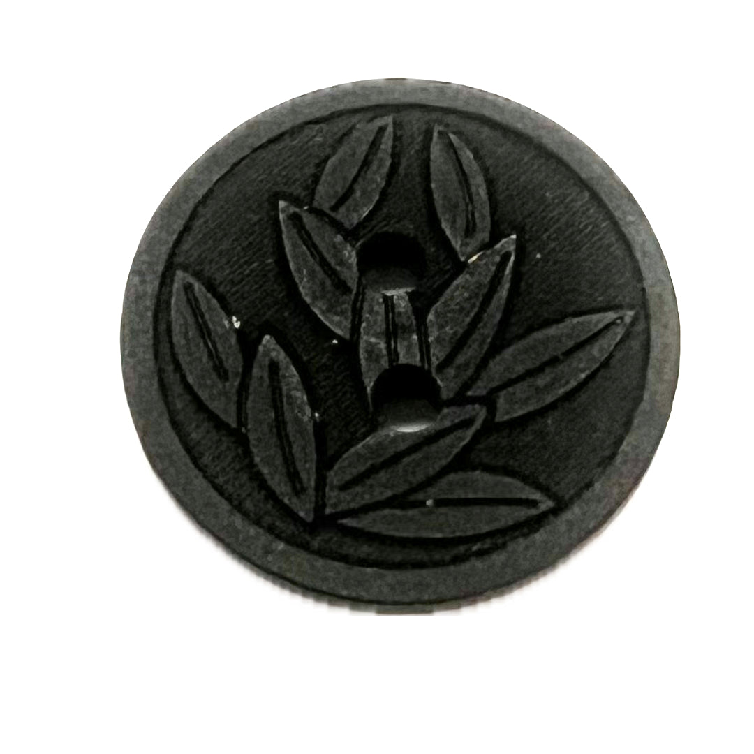 black button with leaf design.