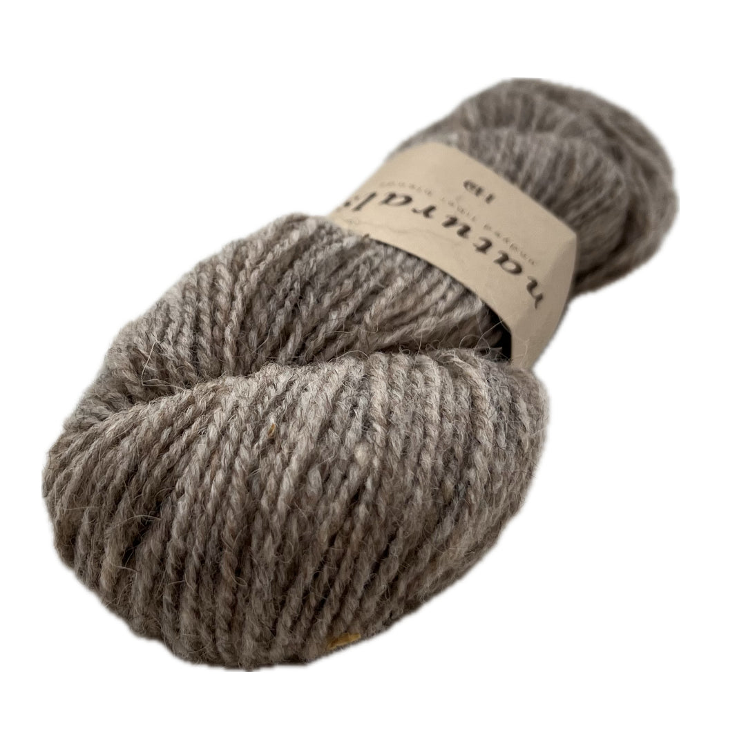 This is Sire, it's the darkest of the natural colors. It stops short of being called brown, it's rich in tone but light enough to show off cables.