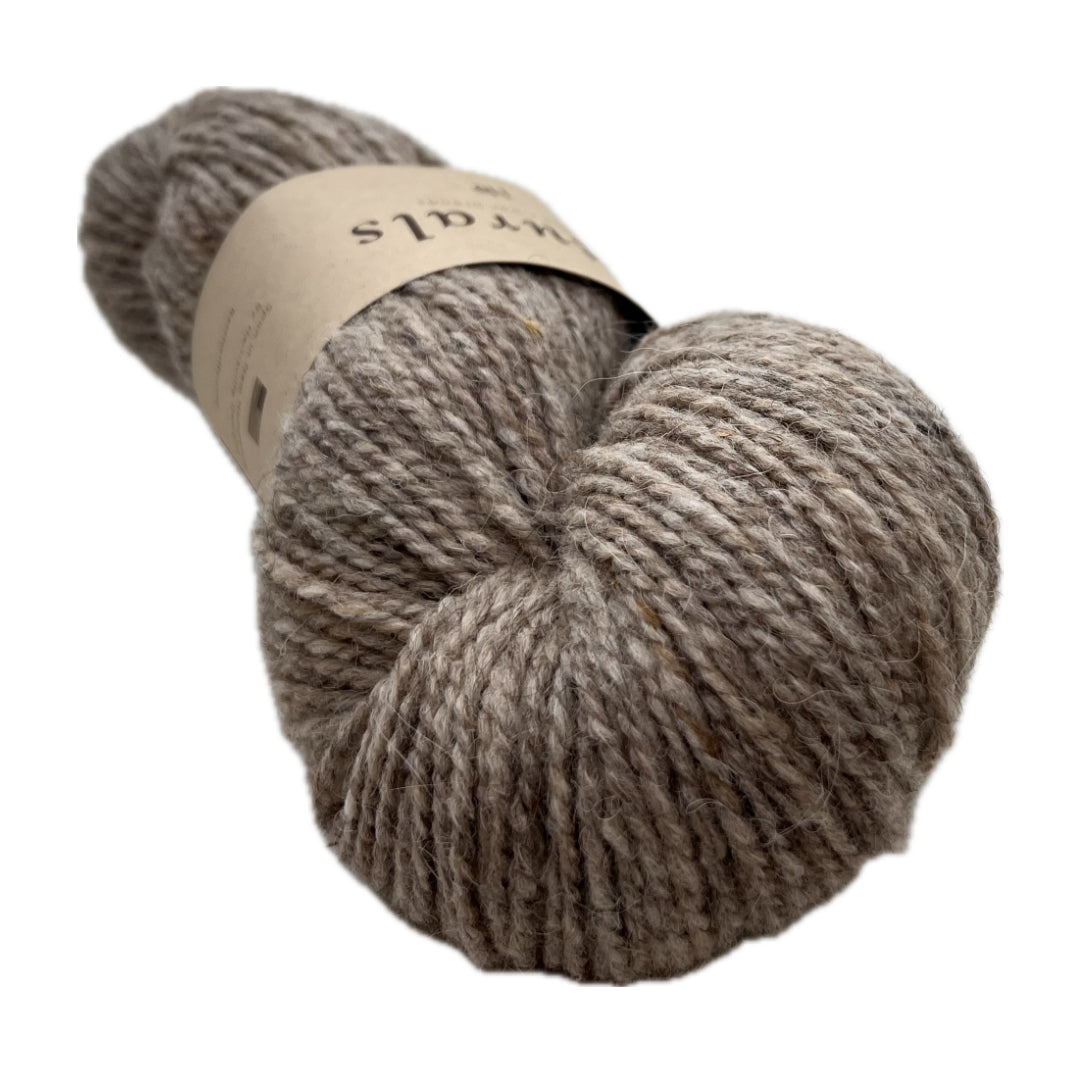 This is Sire, it's the darkest of the natural colors. It stops short of being called brown, it's rich in tone but light enough to show off cables.