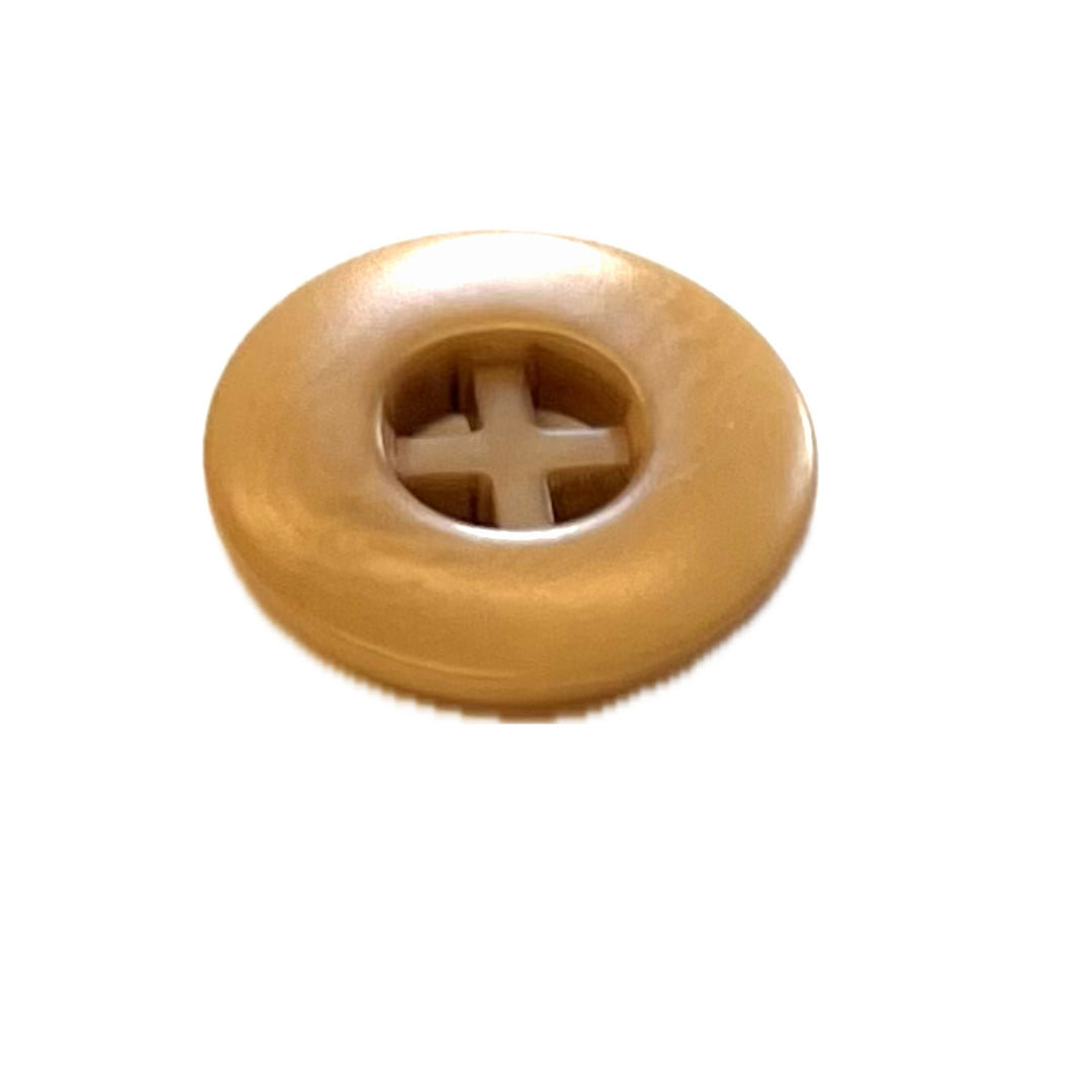 tan button with center cross.
