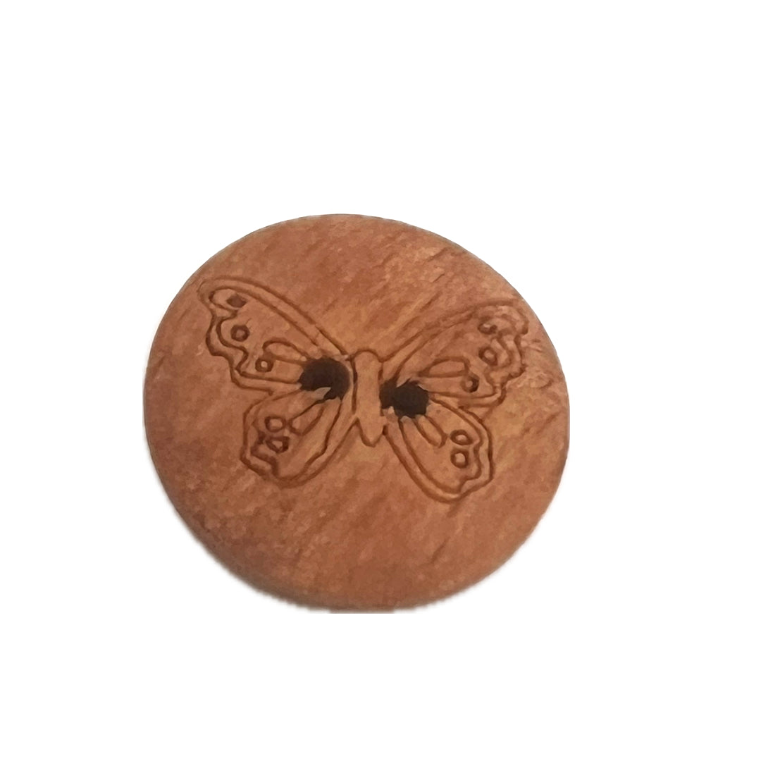 Wooden button with 2 holes and the outline of a butterfly on it.