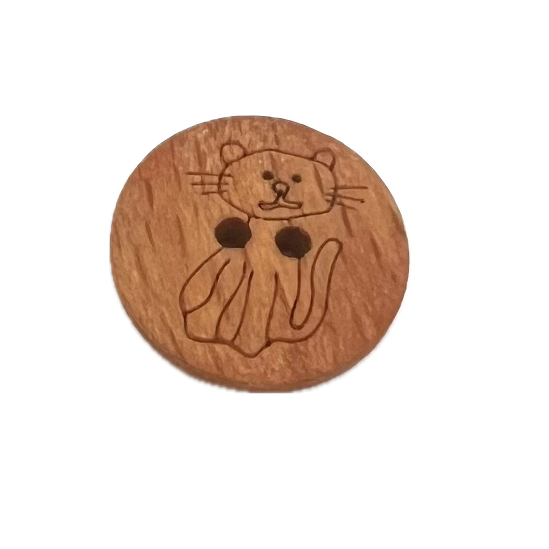 2 holed button with the outline of a cat lightly carved into it. 